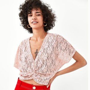 Light pink blush floral lace crop top with tiny red polka dots and twist front